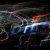 Vibrant abstract image featuring colorful light trails against a dark background.